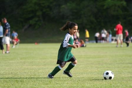 Girl playing soccer