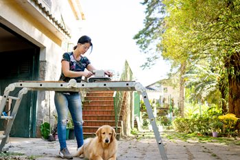 iStock-1256517987.jpg Woman working on a home improvement project.